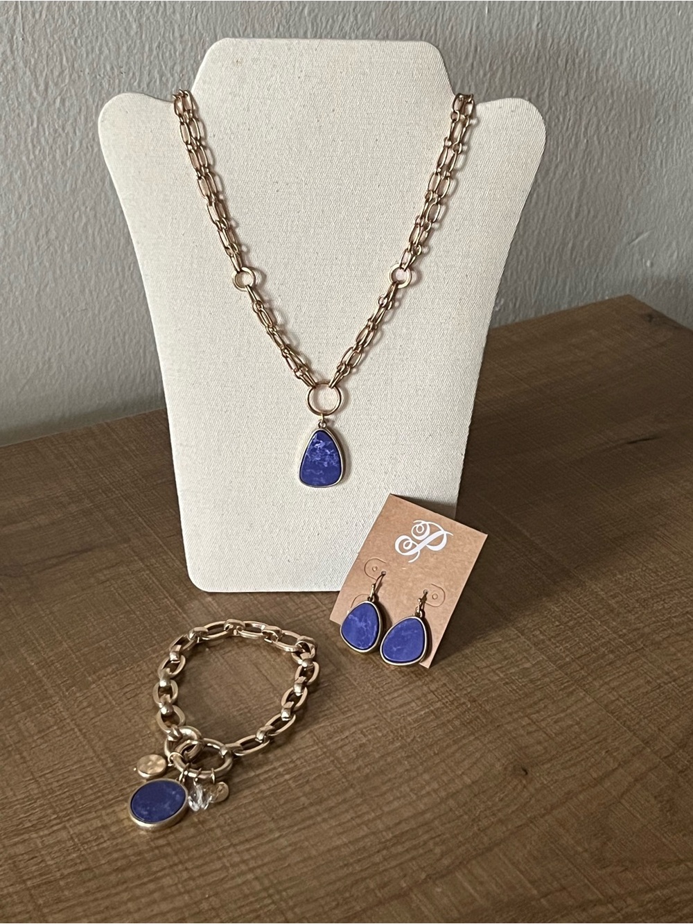 Brushed Gold-tone matte finish, plunder jewelry set with Blue Pendan